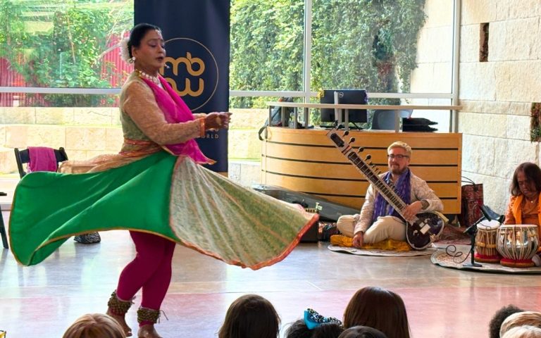 Indian dancer and musicians performing for children.